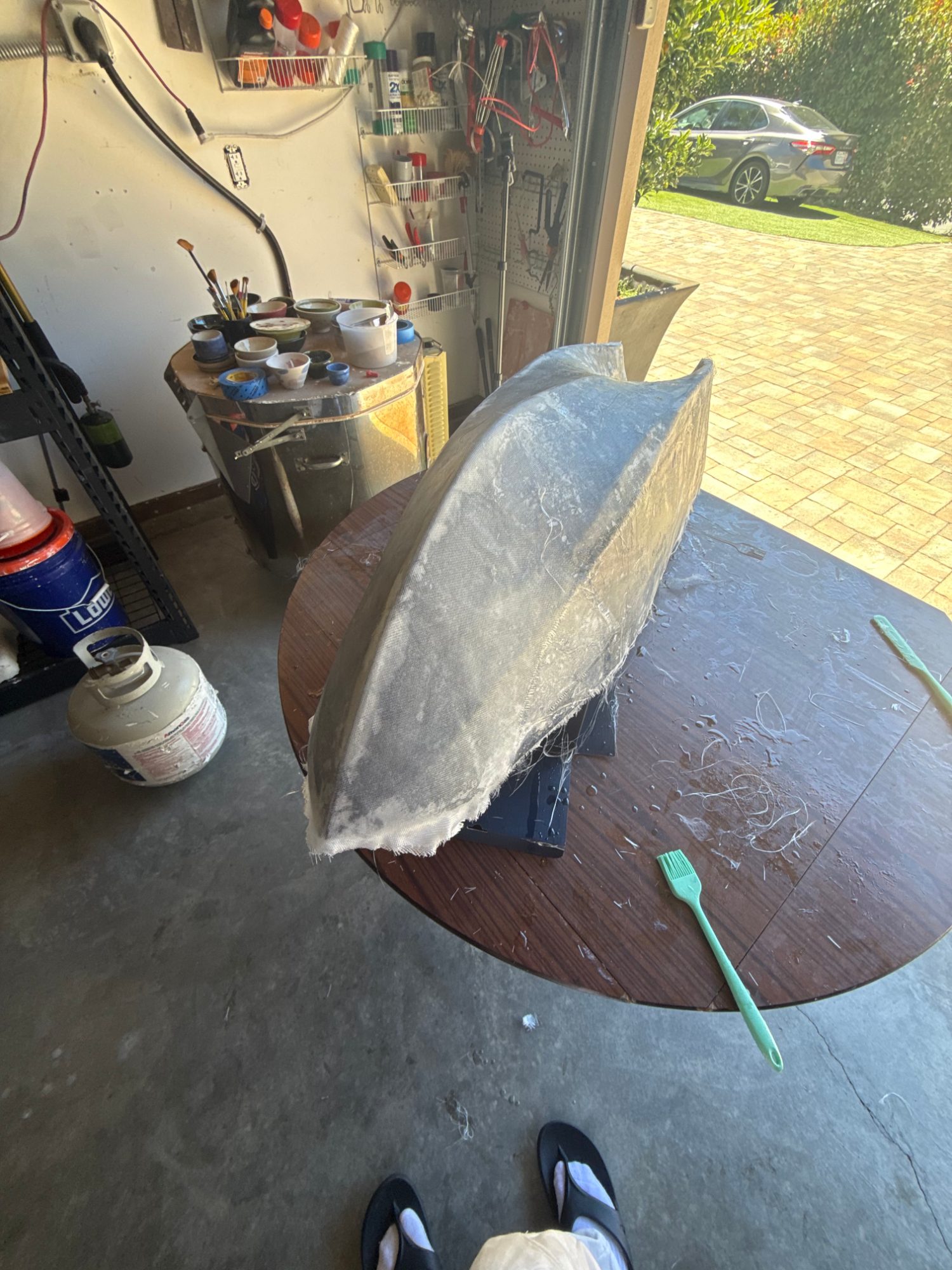 Fiberglass cloth laid over a boat hull and wetted out with epoxy