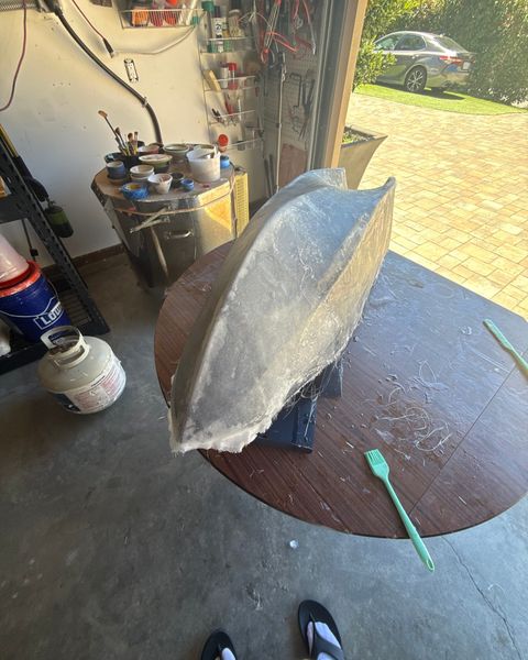 Fiberglass cloth wetted out with epoxy over a printed hull